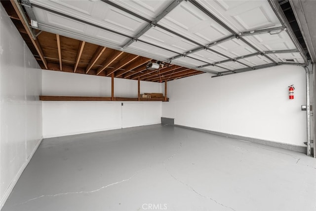 3721 Country Club Dr Unit 18, Long Beach, CA 90807 - garage with baseboards and a garage door opener