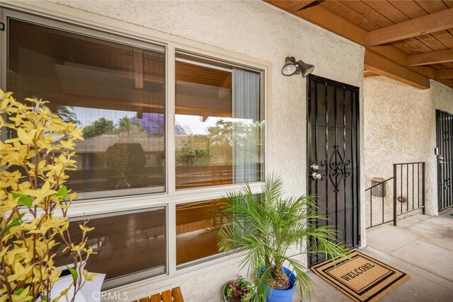 3721 Country Club Dr Unit 18, Long Beach, CA 90807 - doorway to property featuring stucco siding