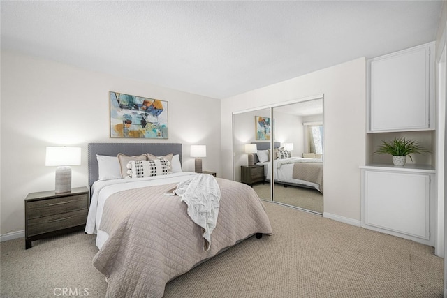 3721 Country Club Dr Unit 18, Long Beach, CA 90807 - bedroom featuring light colored carpet and a closet