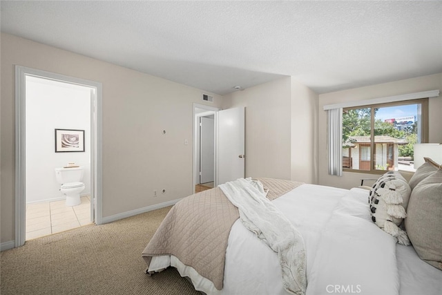 3721 Country Club Dr Unit 18, Long Beach, CA 90807 - bedroom with light carpet, connected bathroom, a textured ceiling, and light tile patterned floors