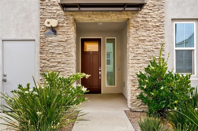 142 Juniper Dr, Rancho Mission Viejo, CA 92694 - entrance to property featuring stone siding and stucco siding