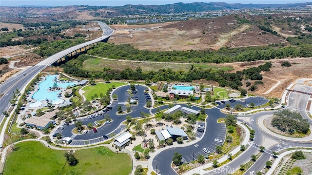 142 Juniper Dr, Rancho Mission Viejo, CA 92694 - aerial overview of property's location with a pool area and a mountainous background