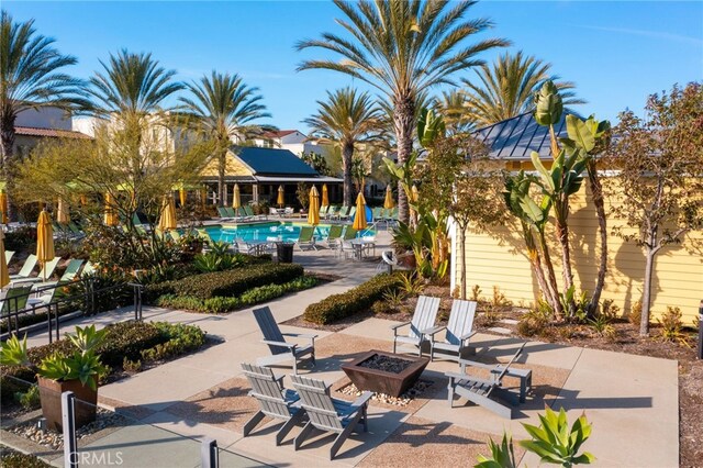 142 Juniper Dr, Rancho Mission Viejo, CA 92694 - view of patio with a fire pit and a community pool