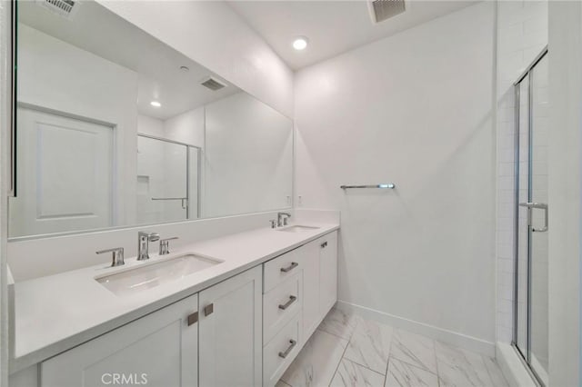 142 Juniper Dr, Rancho Mission Viejo, CA 92694 - bathroom featuring a shower stall, marble finish flooring, double vanity, baseboards, and recessed lighting