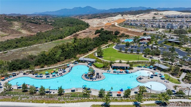 142 Juniper Dr, Rancho Mission Viejo, CA 92694 - drone / aerial view of a pool area and a mountainous background