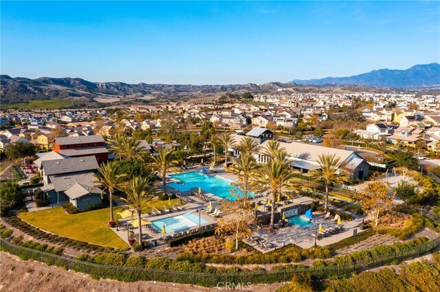 142 Juniper Dr, Rancho Mission Viejo, CA 92694 - aerial perspective of suburban area featuring a pool and a mountainous background