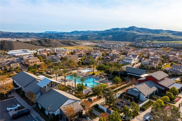 142 Juniper Dr, Rancho Mission Viejo, CA 92694 - aerial perspective of suburban area with a mountain backdrop and a pool