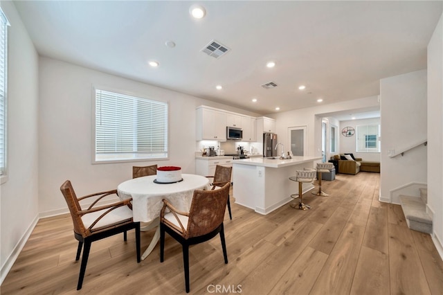 142 Juniper Dr, Rancho Mission Viejo, CA 92694 - dining area with light wood-type flooring, stairs, baseboards, and recessed lighting