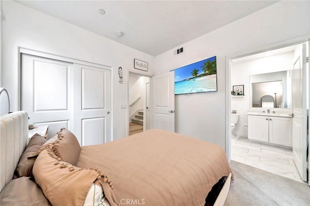 142 Juniper Dr, Rancho Mission Viejo, CA 92694 - bedroom with light marble finish floors, ensuite bathroom, a sink, and a closet