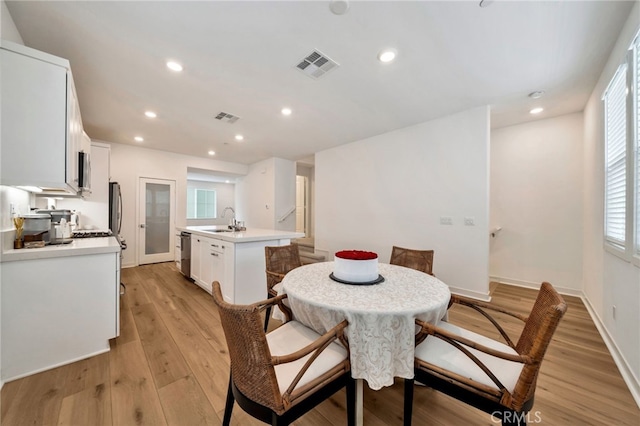 142 Juniper Dr, Rancho Mission Viejo, CA 92694 - dining area with healthy amount of natural light, light wood-style flooring, recessed lighting, and baseboards