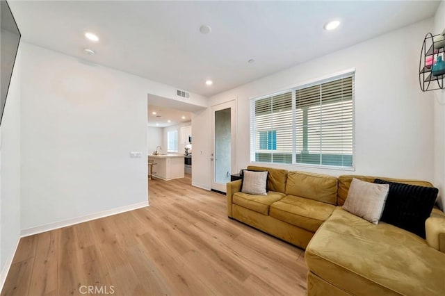 142 Juniper Dr, Rancho Mission Viejo, CA 92694 - living room featuring light wood-type flooring, baseboards, and recessed lighting