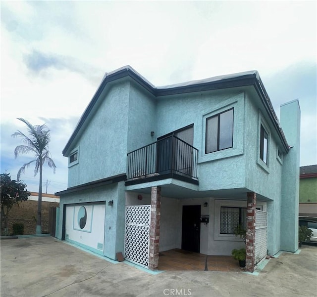 3748 W 118th St, Hawthorne, CA 90250 - back of property with a balcony and stucco siding