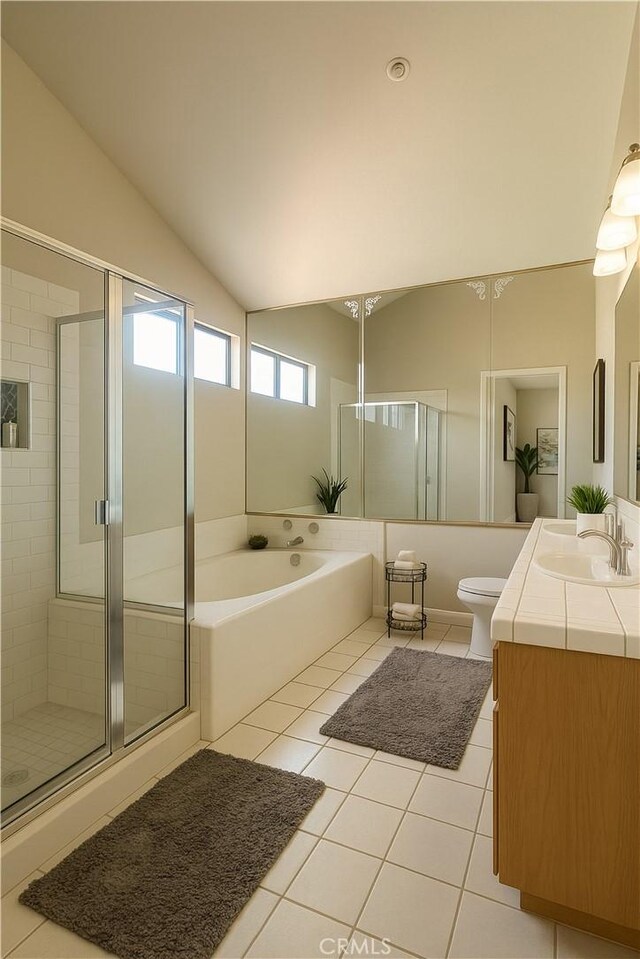 3748 W 118th St, Hawthorne, CA 90250 - full bath with tile patterned flooring, vanity, vaulted ceiling, a stall shower, and a bath