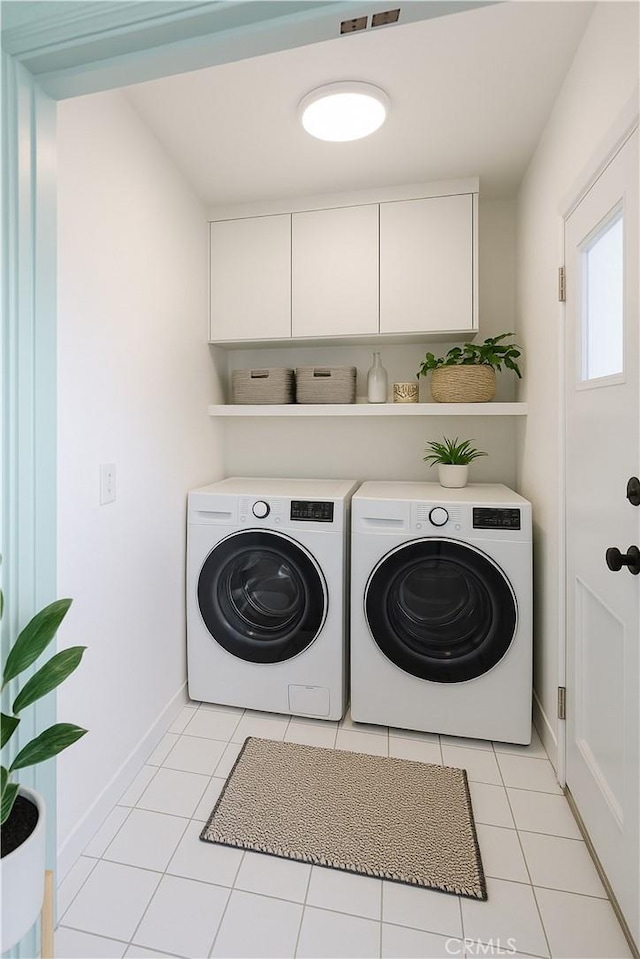 3748 W 118th St, Hawthorne, CA 90250 - laundry room featuring washing machine and dryer, cabinet space, and light tile patterned floors