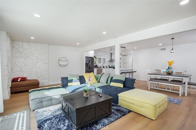 5911 Jones Ave, Westminster, CA 92683 - living area with light wood finished floors, recessed lighting, and baseboards
