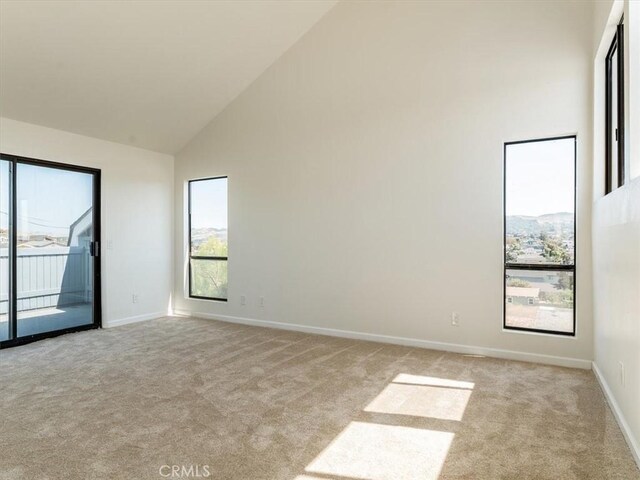 1311 15th St, Los Osos, CA 93402 - unfurnished room featuring light colored carpet and high vaulted ceiling