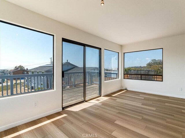 1311 15th St, Los Osos, CA 93402 - unfurnished room with wood finished floors and healthy amount of natural light