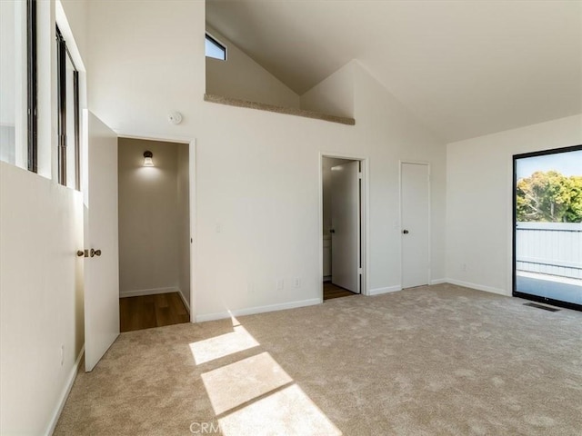 1311 15th St, Los Osos, CA 93402 - unfurnished bedroom featuring carpet floors, high vaulted ceiling, and access to exterior