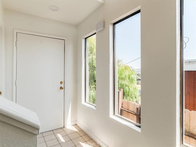 1311 15th St, Los Osos, CA 93402 - entryway featuring light tile patterned floors and baseboards