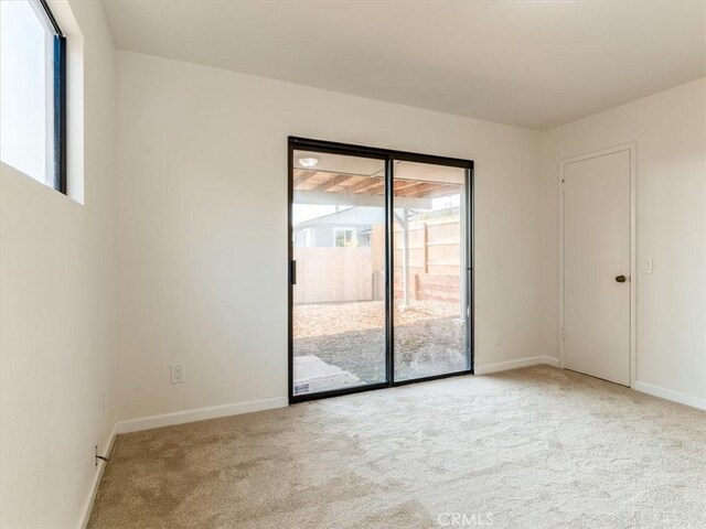 1311 15th St, Los Osos, CA 93402 - unfurnished room with carpet floors and plenty of natural light
