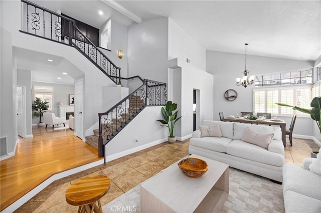 2300 Meadow View Ln, Chino Hills, CA 91709 - living room featuring stairway, high vaulted ceiling, a chandelier, baseboards, and recessed lighting