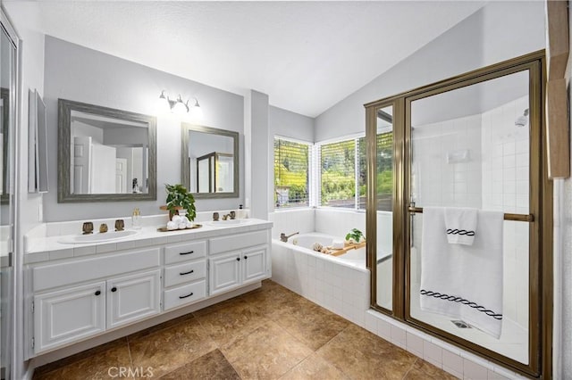 2300 Meadow View Ln, Chino Hills, CA 91709 - bathroom featuring lofted ceiling, double vanity, a bath, a stall shower, and tile patterned flooring