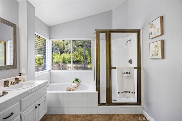 2300 Meadow View Ln, Chino Hills, CA 91709 - full bath with vanity, a garden tub, a stall shower, vaulted ceiling, and tile patterned floors