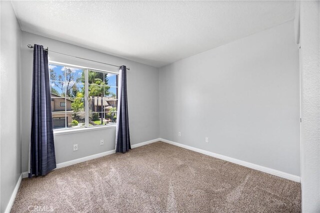 2300 Meadow View Ln, Chino Hills, CA 91709 - unfurnished room featuring carpet, baseboards, and a textured ceiling