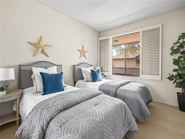 2563 Plaza Del Amo Unit 312, Torrance, CA 90503 - carpeted bedroom with a textured ceiling and baseboards
