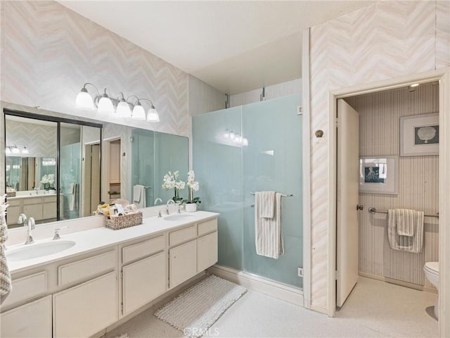 2563 Plaza Del Amo Unit 312, Torrance, CA 90503 - full bath with wallpapered walls, double vanity, walk in shower, toilet, and baseboards