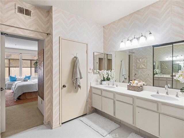 2563 Plaza Del Amo Unit 312, Torrance, CA 90503 - ensuite bathroom with wallpapered walls and double vanity