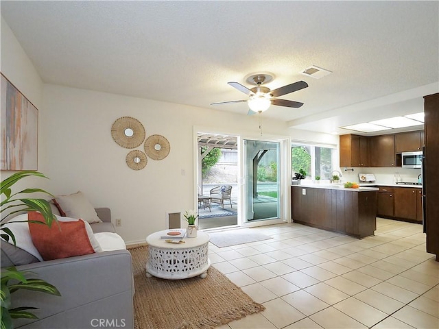 28408 Quailhill Dr, Rancho Palos Verdes, CA 90275 - living area with a ceiling fan and light tile patterned floors