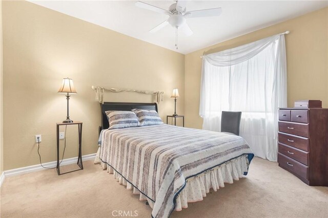 26835 Eclipse Dr, Menifee, CA 92585 - bedroom with light colored carpet, baseboards, and a ceiling fan