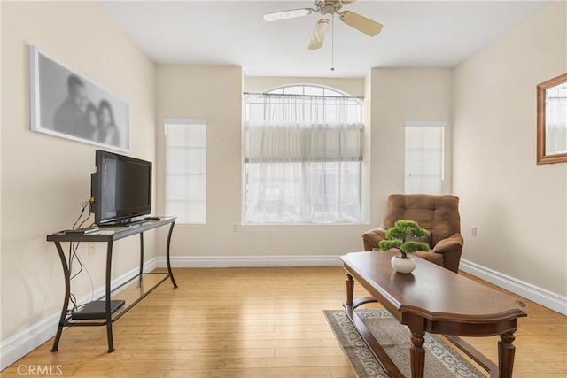 26835 Eclipse Dr, Menifee, CA 92585 - sitting room with plenty of natural light, ceiling fan, wood finished floors, and baseboards