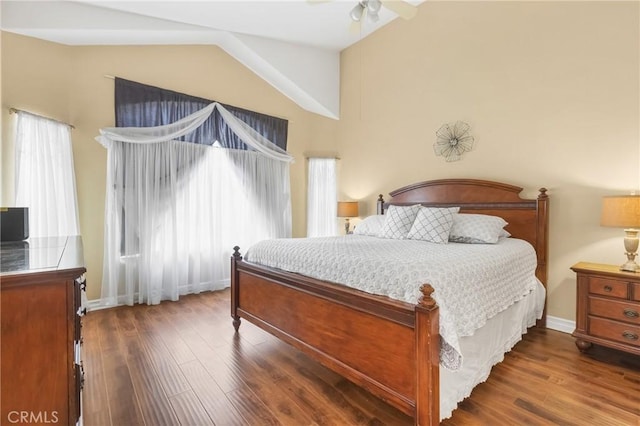 26835 Eclipse Dr, Menifee, CA 92585 - bedroom featuring vaulted ceiling, multiple windows, dark wood-style floors, and baseboards