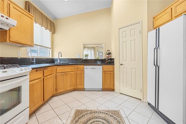 26835 Eclipse Dr, Menifee, CA 92585 - kitchen with white appliances, a sink, light tile patterned floors, dark countertops, and under cabinet range hood