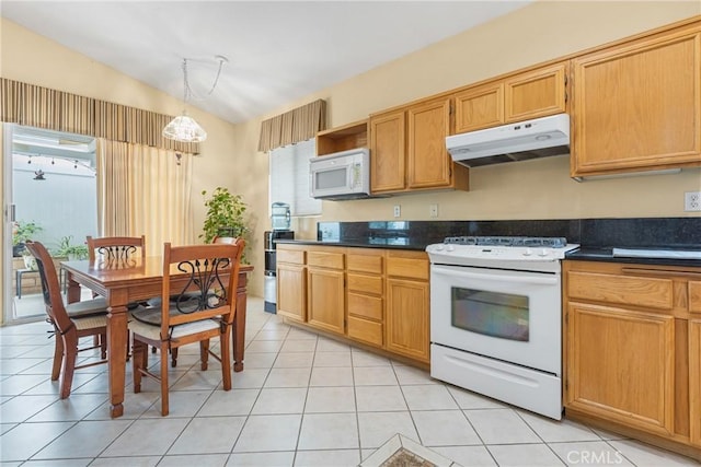 26835 Eclipse Dr, Menifee, CA 92585 - kitchen featuring under cabinet range hood, white appliances, lofted ceiling, dark countertops, and open shelves