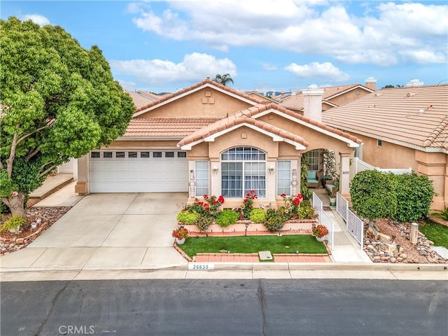 26835 Eclipse Dr, Menifee, CA 92585 - mediterranean / spanish-style house with concrete driveway, stucco siding, a garage, and a tile roof