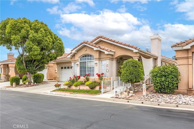26835 Eclipse Dr, Menifee, CA 92585 - mediterranean / spanish-style house featuring an attached garage, concrete driveway, stucco siding, and a tiled roof
