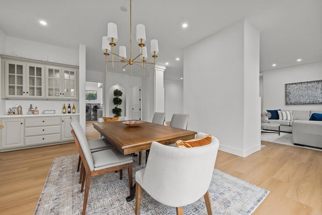18150 Via Ascenso, Rancho Santa Fe, CA 92067 - dining space with washing machine and dryer, light wood-style flooring, a chandelier, recessed lighting, and baseboards