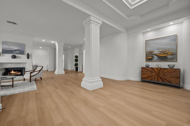 18150 Via Ascenso, Rancho Santa Fe, CA 92067 - living room with ornate columns, light wood-style flooring, recessed lighting, baseboards, and a warm lit fireplace