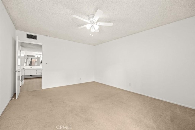 1127 E Del Mar Blvd Unit 235, Pasadena, CA 91106 - spare room featuring light colored carpet, ceiling fan, and a textured ceiling