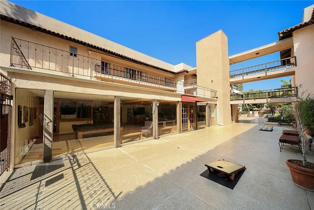 1127 E Del Mar Blvd Unit 235, Pasadena, CA 91106 - rear view of house with a balcony and a patio