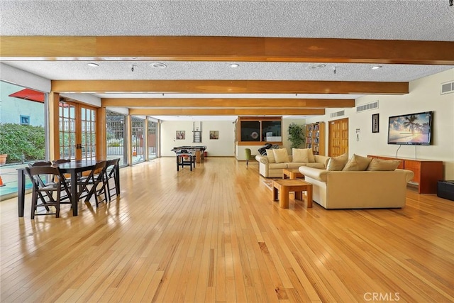 1127 E Del Mar Blvd Unit 235, Pasadena, CA 91106 - living room with light wood finished floors and beam ceiling