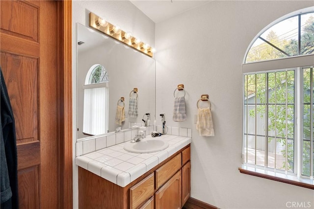 908 Knickerbocker Rd, Big Bear Lake, CA 92315 - bathroom featuring vanity, healthy amount of natural light, and baseboards