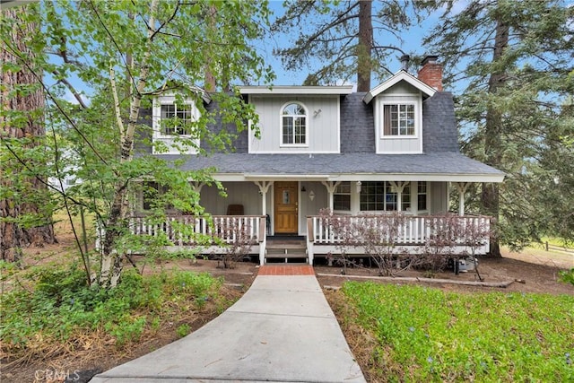 908 Knickerbocker Rd, Big Bear Lake, CA 92315 - farmhouse-style home featuring a chimney and a porch