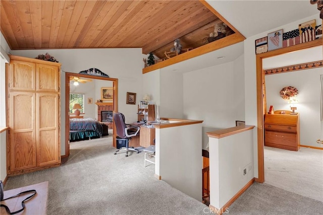 908 Knickerbocker Rd, Big Bear Lake, CA 92315 - office area featuring light colored carpet, vaulted ceiling, wood ceiling, a fireplace, and baseboards