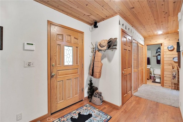 908 Knickerbocker Rd, Big Bear Lake, CA 92315 - foyer entrance with wood ceiling, light wood-style floors, and baseboards
