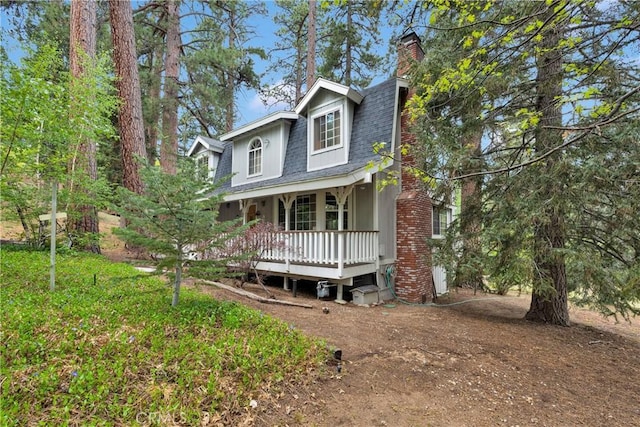 908 Knickerbocker Rd, Big Bear Lake, CA 92315 - view of property with a porch, roof with shingles, and a chimney