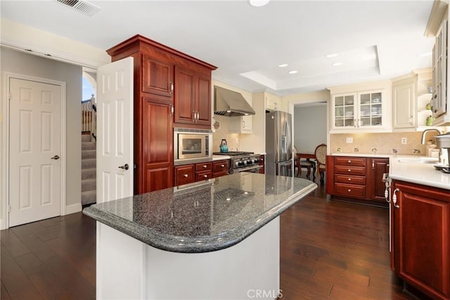 24092 Lapwing Ln, Laguna Niguel, CA 92677 - kitchen featuring a sink, extractor fan, appliances with stainless steel finishes, dark brown cabinets, and recessed lighting